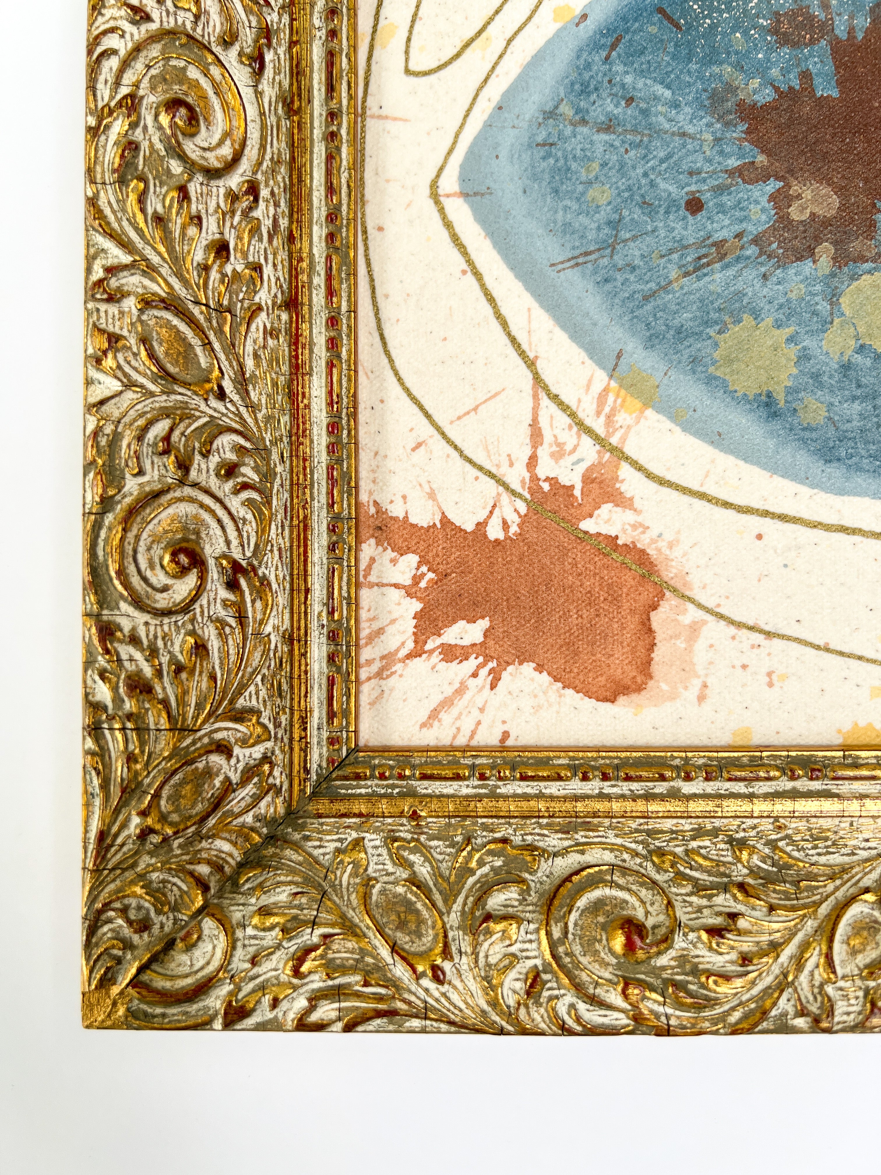 Decorative gold frame with intricate patterns on a white background