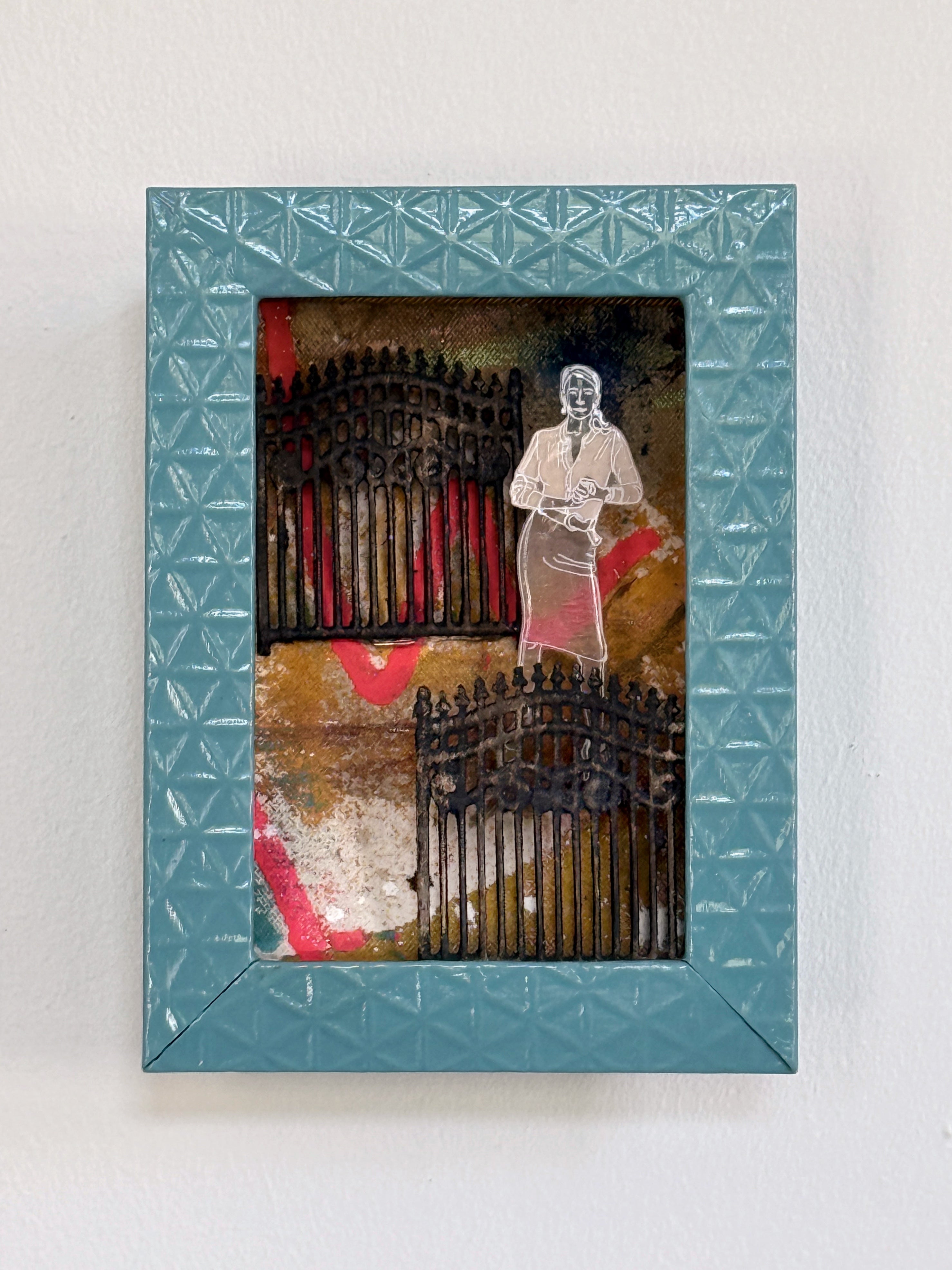 Framed artwork with a person and architectural elements on a textured blue background