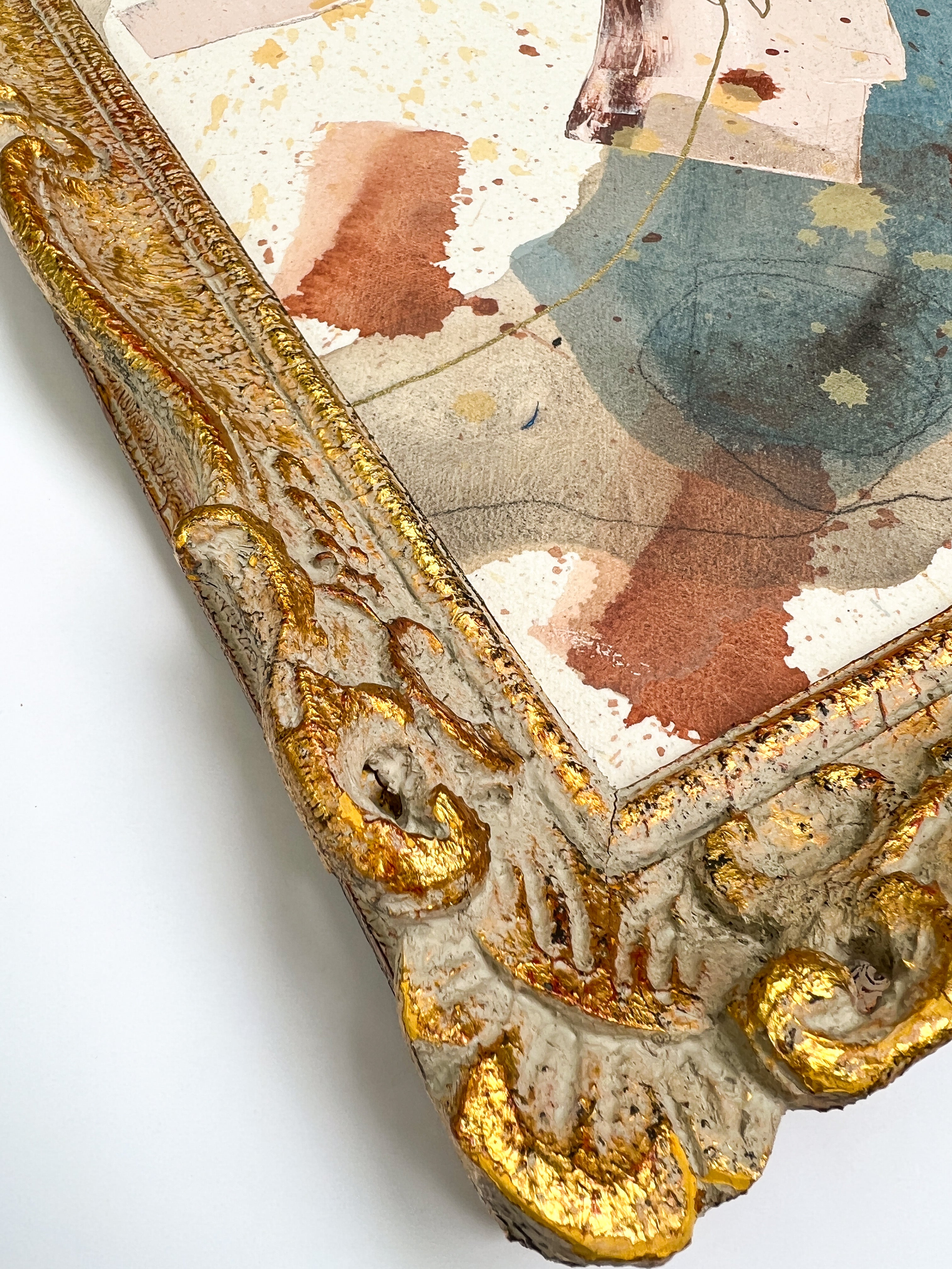 Decorative mirror with gold frame and watercolor background