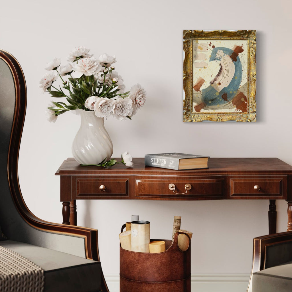 Wooden console table with decorative items including a vase of flowers, books, and a framed painting.