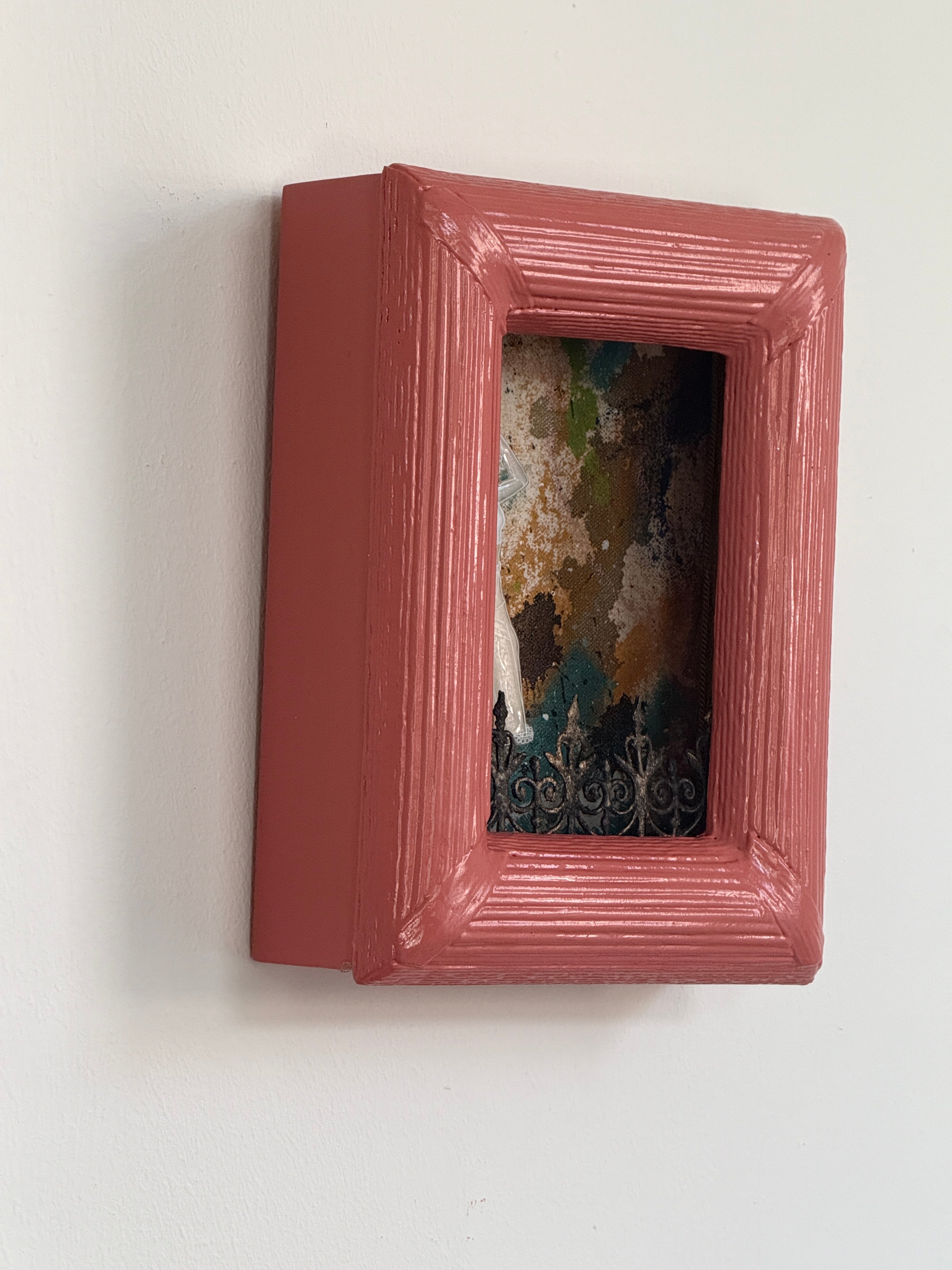 Red decorative box with a textured surface on a white background