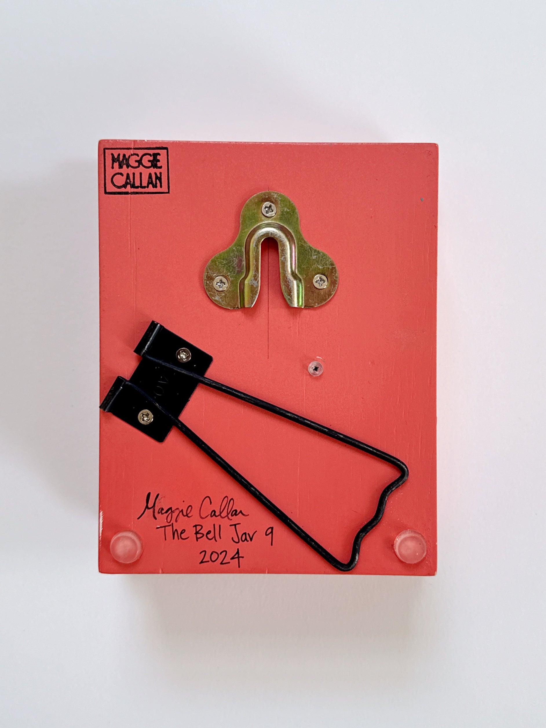 Red box with a brass hook , featuring 'Maggie Callan' branding.